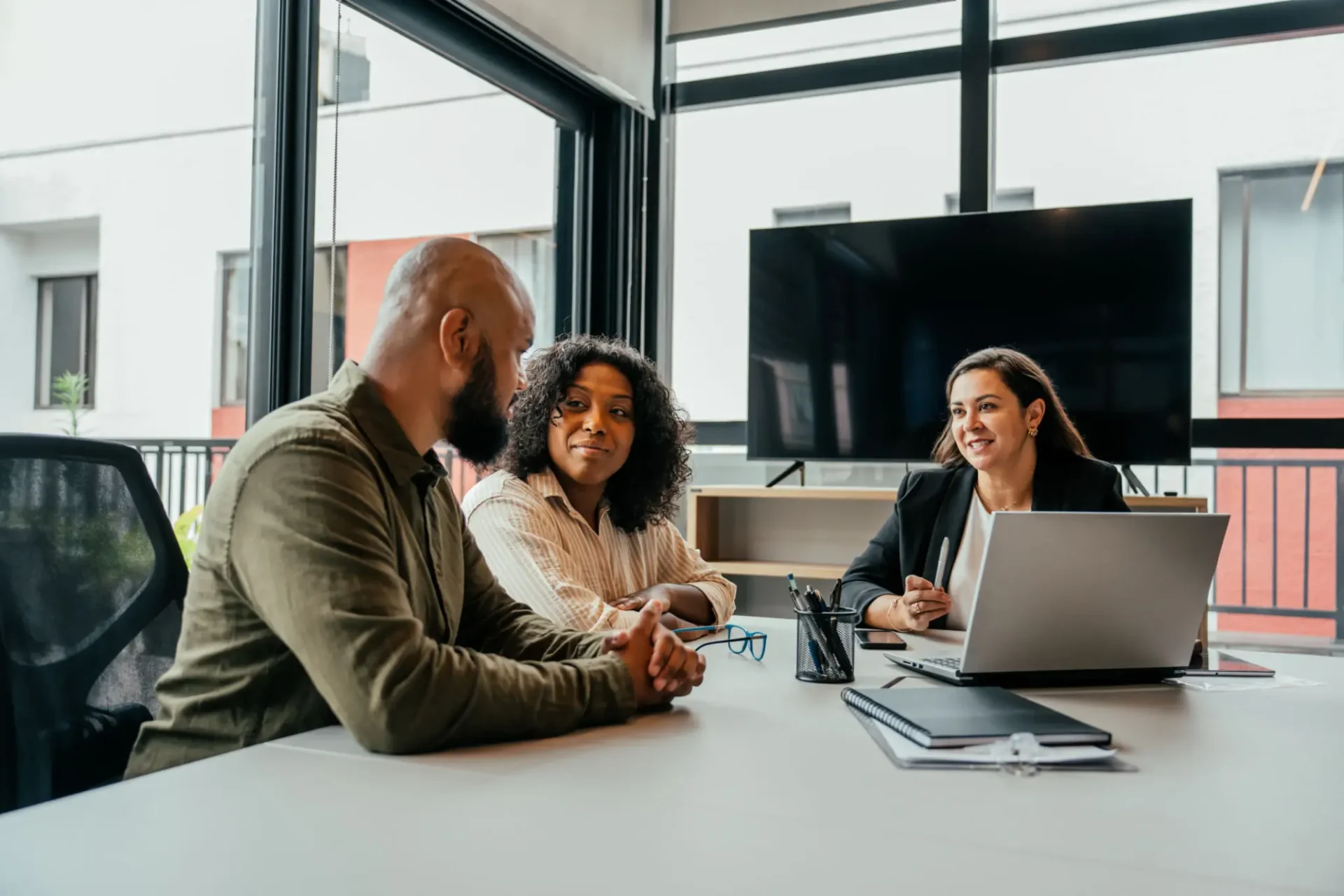 Team collaboration around laptop